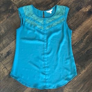 Candie’s teal XS top.